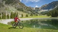Woman on electrick Mountain bike in the Allgaeu Alps near Below Nebelhorn