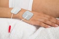 Woman with electrodes on her hand Royalty Free Stock Photo