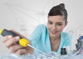 Woman with electronics and screwdriver against white background with graphs Royalty Free Stock Photo