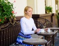 Woman elegant calm face have drink cafe terrace outdoors. Mug of good tea with milk in morning gives me energy charge Royalty Free Stock Photo