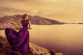 Woman in Elegant Dress on Mountain Coast, Fashion Model Gown