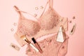 Woman elegant pink lace bra and panties, jewelry. Stylish lingerie flat lay. Royalty Free Stock Photo