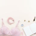 Woman elegant pink lace bra and panties, pumps and jewelry. Stylish lingerie flat lay.