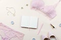 Woman elegant pink lace bra and panties, pumps and jewelry. Stylish lingerie flat lay.