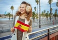 Woman on embankment with Spanish flag looking into distance Royalty Free Stock Photo