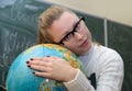 Woman embrace a globe
