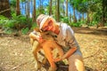 Woman embraces kangaroo