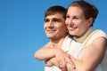 Woman embraces man from behind Royalty Free Stock Photo