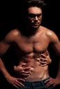 Woman embracing topless muscular man
