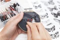 Woman embroider a butterfly. Process of making handmade embroidery. Hobby. Sewing tools. Remote home work.