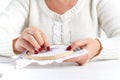 Woman embroidering cross lavender