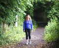 A Woman Emerges from a Shadowy Snicket Royalty Free Stock Photo