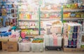 The woman employer wear surgical mask arranging food at the supermarket aisle for prepare to shopper buy to hoarding food for the