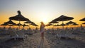 Woman on empty beach at sunset Royalty Free Stock Photo