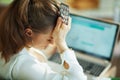 Woman with empty blister buying pharma on laptop