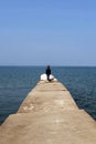 Woman at end of long pier