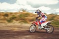 Woman on enduro motocross in motion, desire for victory, dynamics of speed