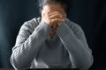 Woman engaged in prayer. In the quiet darkness of a sacred room, she seeks solace, spiritual connection. Immerse yourself in the Royalty Free Stock Photo