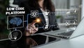 Woman Engaging with Low Code Platform Interface on Laptop Screen, Business Innovation, Digital Transformation Royalty Free Stock Photo