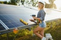 Woman engineer checking solar panels setup Royalty Free Stock Photo