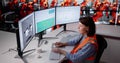 Woman Engineer Monitors Factory Production Using SCADA System Royalty Free Stock Photo