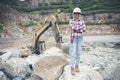 Woman Engineer and safety Officer concept.Young woman engineer wearing safety hat helmet, safety glasses, and holding portable Royalty Free Stock Photo