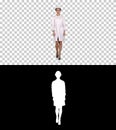 Woman engineer in white robe and white hard hat walking, Alpha C Royalty Free Stock Photo