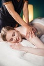 Woman enjoing back massage at spa. Leisure, Health, Luxury Lifestyle Concept Royalty Free Stock Photo