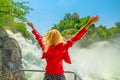 woman enjoing Rhine Falls waterfall