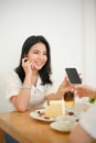 Woman enjoy chatting with her best friends while relaxing in the cafe Royalty Free Stock Photo