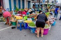 A woman is enjoy choosing fruits at Prachuabkirikhan morning market showing local lifestyle. Prachuabkirikhan Thailand June 10,