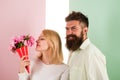 Woman enjoy fragrance bouquet flowers. Couple in love happy celebrate anniversary. Lady likes flower husband gifted her Royalty Free Stock Photo