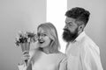 Woman enjoy fragrance bouquet flowers. Man with beard takes care about girlfriend happiness. Lady likes flower husband Royalty Free Stock Photo