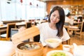Woman enjoy her meal in chinese restaurant