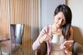 Woman enjoy her morning coffee and using cellphone Royalty Free Stock Photo