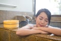 Woman enjoy hot springs in Japanese onsen