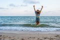 Woman enjoy and jumping on sea beach Royalty Free Stock Photo