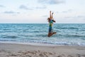 Woman enjoy and jumping on sea beach Royalty Free Stock Photo