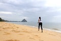 Woman enjoy morning running on beach