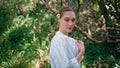 Woman enjoy nature harmony walking green forest closeup. Girl strolling at park Royalty Free Stock Photo