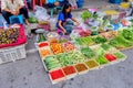 A woman is enjoy selling vegetables at Prachuabkirikhan morning market showing local lifestyle. Prachuabkirikhan Thailand June 10