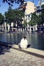 Woman enjoy sunny weather by canal Saint-Martin
