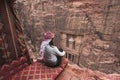 A woman enjoy view of Amman capital city of Jordan, Arab sitting in front of the Treasury in Petra ruin and ancient city in Jordan