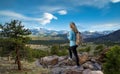 Woman enjoying beautiful scenery on hiking trip.