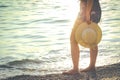 Woman enjoying the beautiful sunset on the beach. Royalty Free Stock Photo