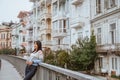 woman enjoying the beauty of building in arnavutkoy