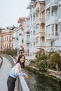 woman enjoying the beauty of building in arnavutkoy