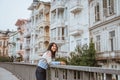 woman enjoying the beauty of building in arnavutkoy