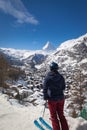 Woman enjoying cityscape of Zermatt, Switzerland with Matterhorn