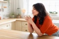 Woman enjoying a coffee break at home